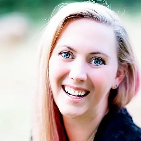 7 author Shoutouts Rebecca Yarros smiling with long hair outdoors