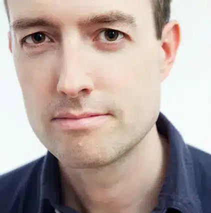 7 author Shoutouts Adam Haslett in a blue shirt and neutral expression