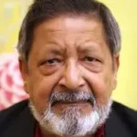 House of Mr Biswas author V.S. Naipaul with gray beard and suit