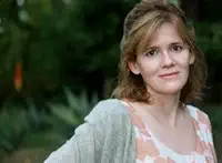 Go Gentle author Maria Semple in floral dress outdoors.