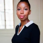 The Witch author Marie Ndiaye in black outfit, neutral expression.