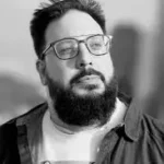 Republic of Memory The Republic of Memory author Mahmud El Sayed with glasses and beard outdoors