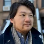 Seek Immediate Shelter Seek Immediate Shelter author Vincent Yu with dark hair and scarf.