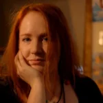 Femmephilia Femmephilia author Sophie Lewis with red hair, thoughtful expression.