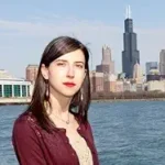 Man Overboard! Man Overboard author Katheleen Rooney by water with Chicago city skyline