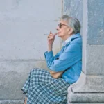 The Acrobat The Acrobat poet Wislawa Szymborska sitting, smoking, contemplative.