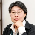 A Plagued Sea A Plagued Sea author Kim Bo-young with glasses and short hair