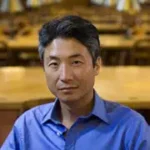 A Tender Age A Tender Age author Chang-rae Lee in blue shirt, library background