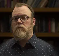 Black River Orchard Black River Orchard author Chuck Wendig with glasses and beard.