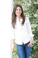 Breathing Under Water author Jacqueline Friedland in white shirt and jeans.