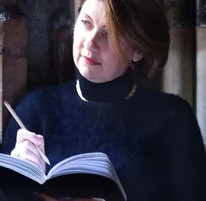 A Far-Flung Life A Far-Flung Life author M. L. Stedman writing in a notebook.
