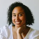 Take What You Can Take What You Can author Naima Coster smiling with curly hair