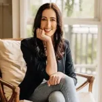 When Lemons Give You Life When Lemons Give You Life author Anna Johnston smiling sitting in sunlight.