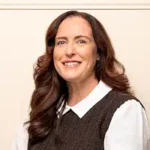 Jewel of Corlivo The Jewel of Corlivo author Kathleen Carr Foster smiling with long brown hair.