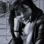 The Stolen Women The Stolen Women author Alysandra Dutton sitting thoughtfully in black and white